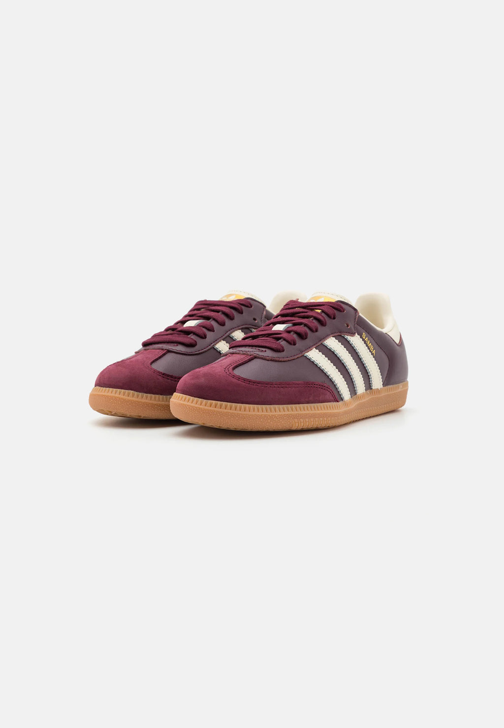 Adidas Samba og Maroon Gold.
Den perfekte sneaker fra Adidas, i sin lækre farve er den garanteret til at få dig til at skille sig ud. Køb denne Samba model allerede idag. 
Set fra siden begge sko
