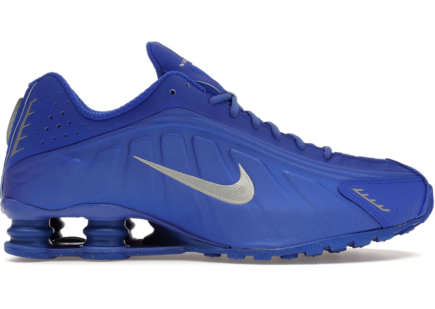 Nike Shox R4 Racer Blue Metallic Silver sneaker med Shox-støddæmpning og metallisk design.